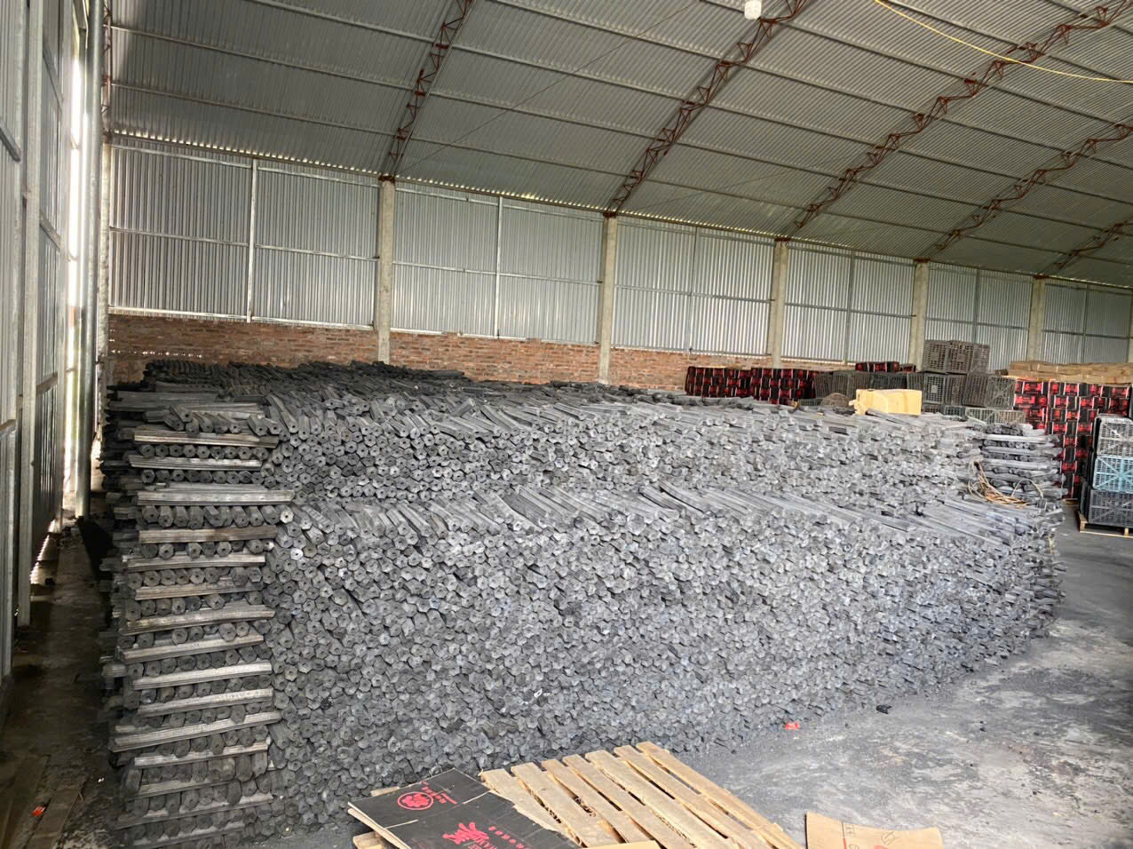 Sawdust Ogatan briquettes stacked in the warehouse