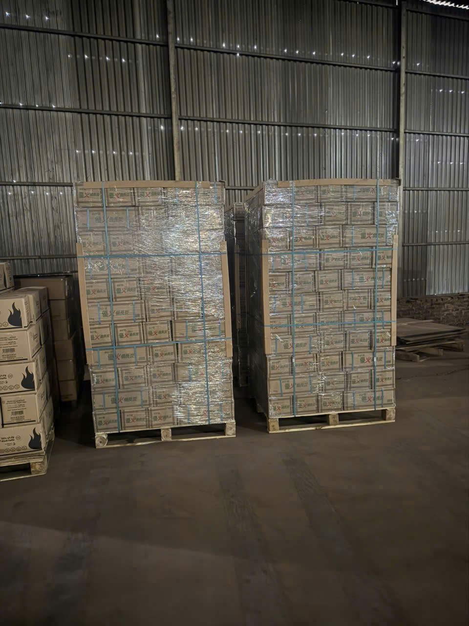Palletised charcoal cartons stored in the warehouse